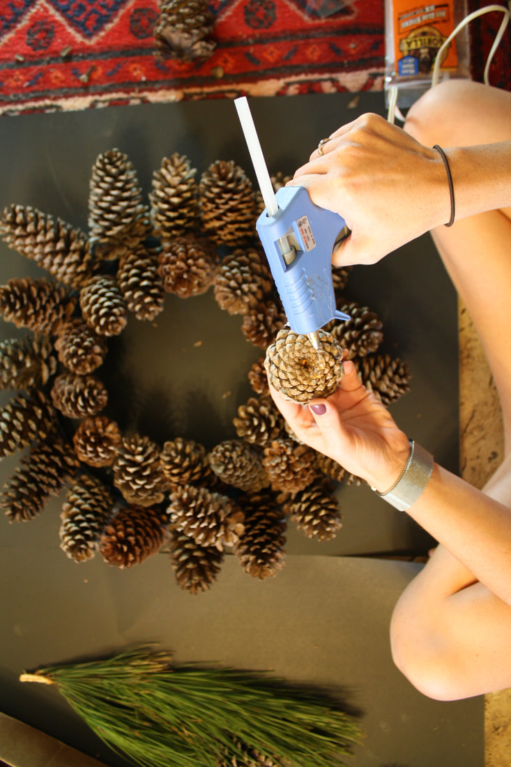 A quick, easy and mostly free tutorial on how to create a pinecone holiday wreath. Great for fall and winter! 