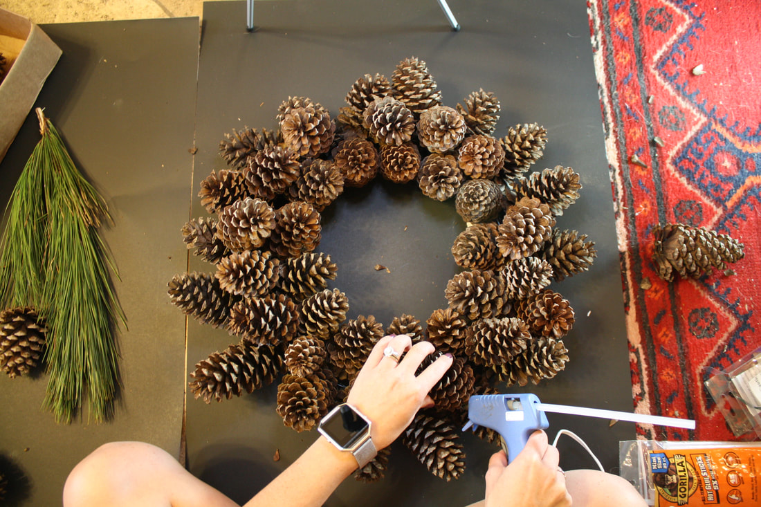 A quick, easy and mostly free tutorial on how to create a pinecone holiday wreath. Great for fall and winter! 